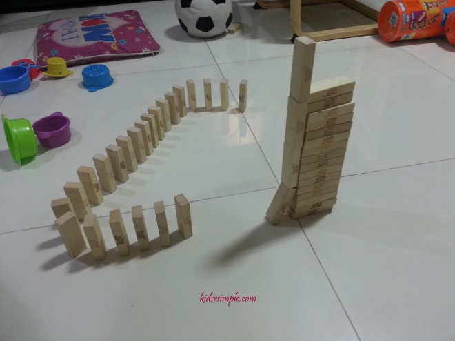 Roll a ball from the top of the tall structure and see what happens